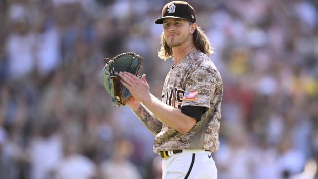 Padres closer Josh Hader claps his glove after a win.
